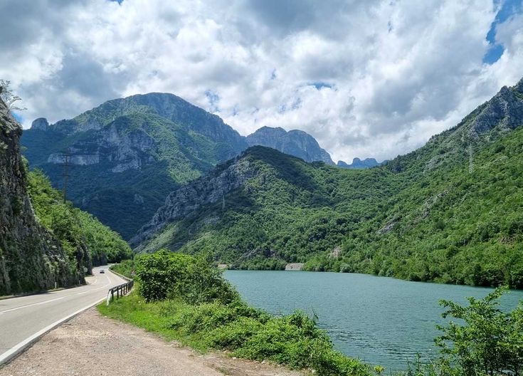 A road following the turquoise Neretva river through the green mountains of Bosnia