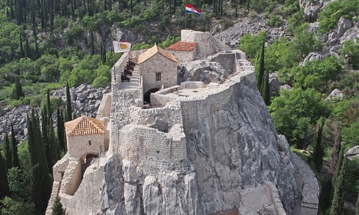 Sokol Grad fortress rising from the rock in the hills of Konavle